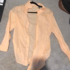 peach colored button down from H&M